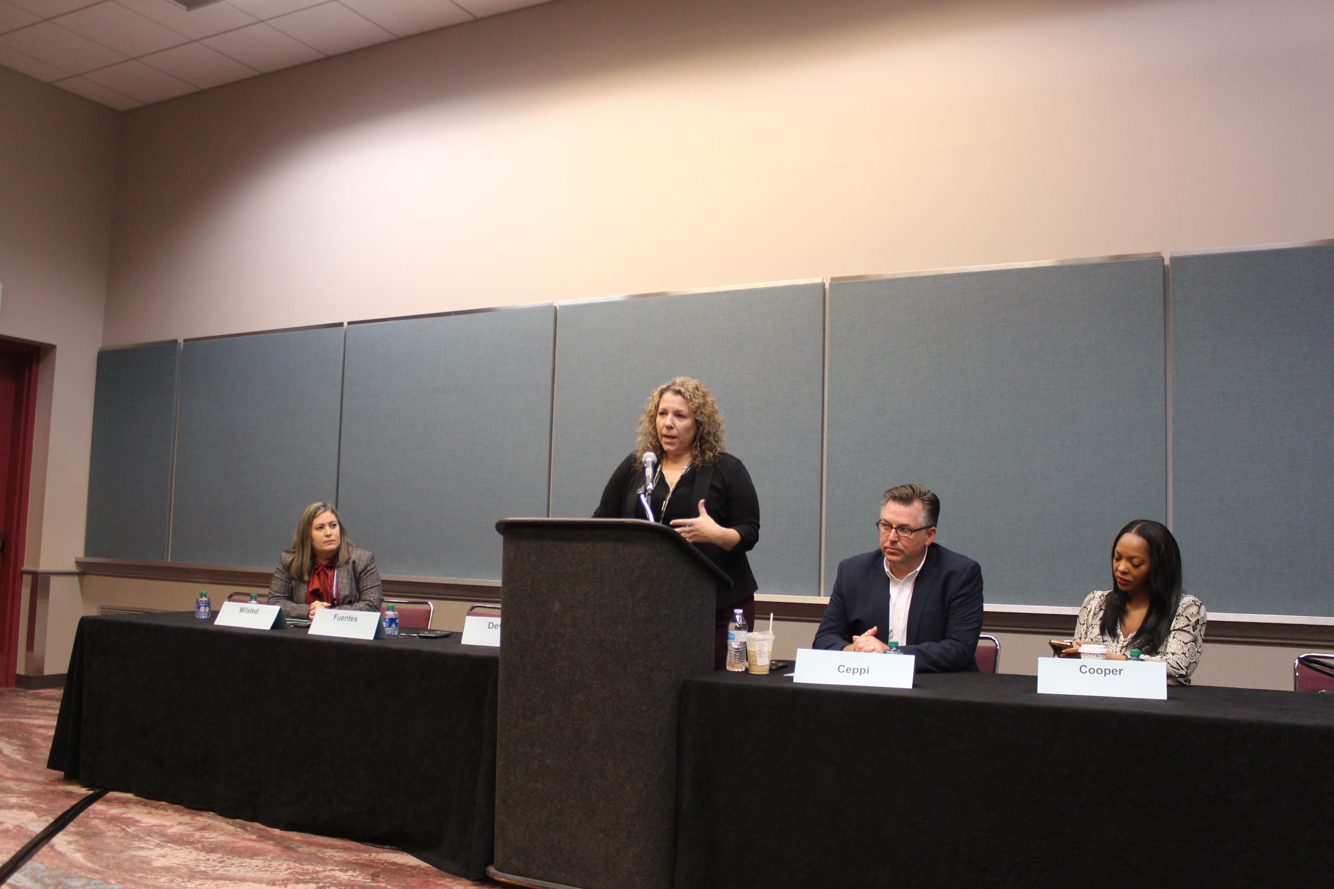 Economic Recovery Act of 2020 Aidita Milsted, Christina Fuentes speaking, Paul Ceppi, and Tai Cooper