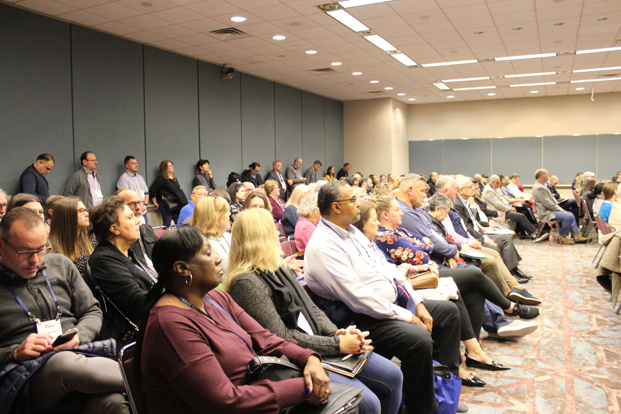 Audience members listening intently