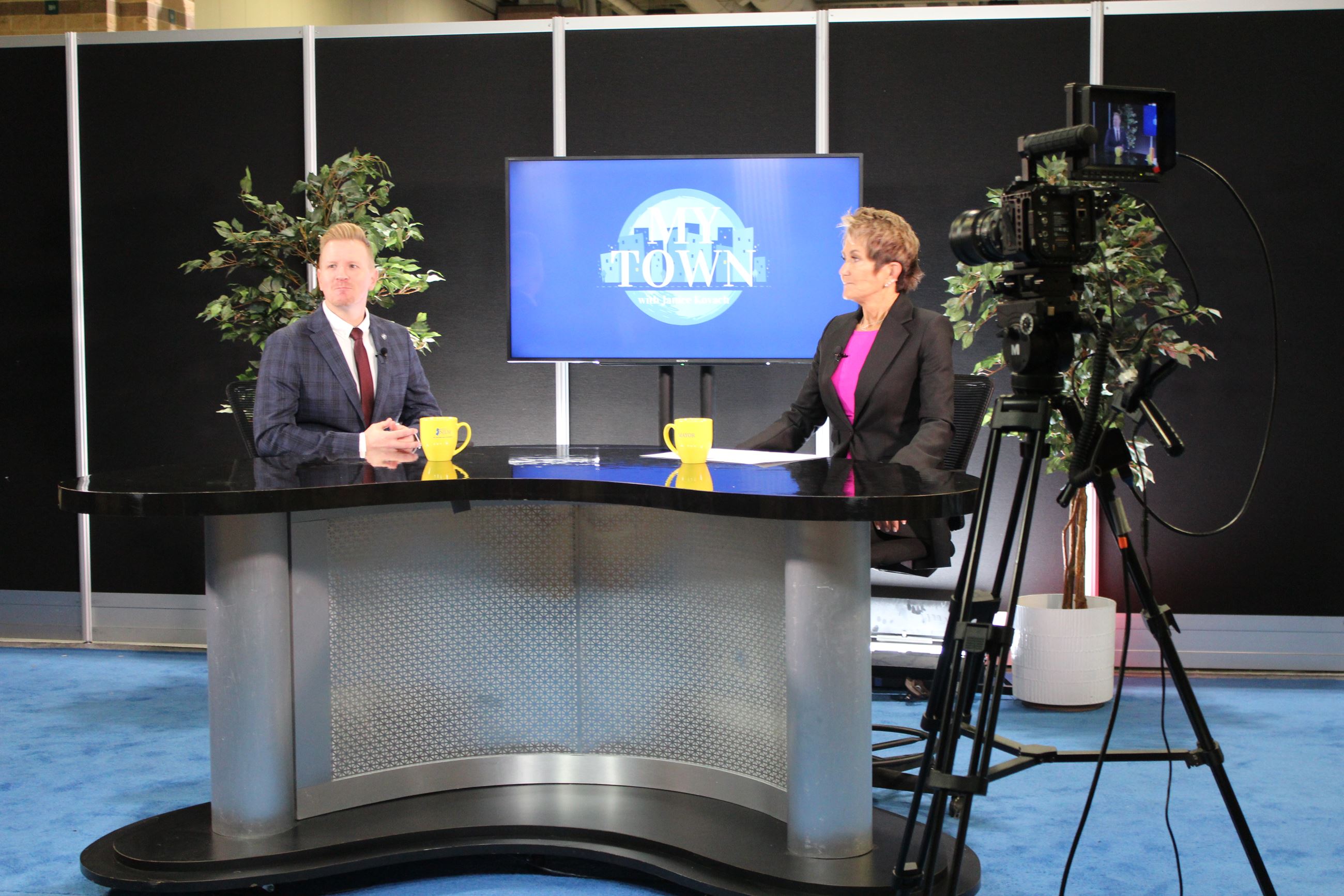 DEP Dir. LaTourette and Janice Kovach tape My Town segment on Exhibit Floor